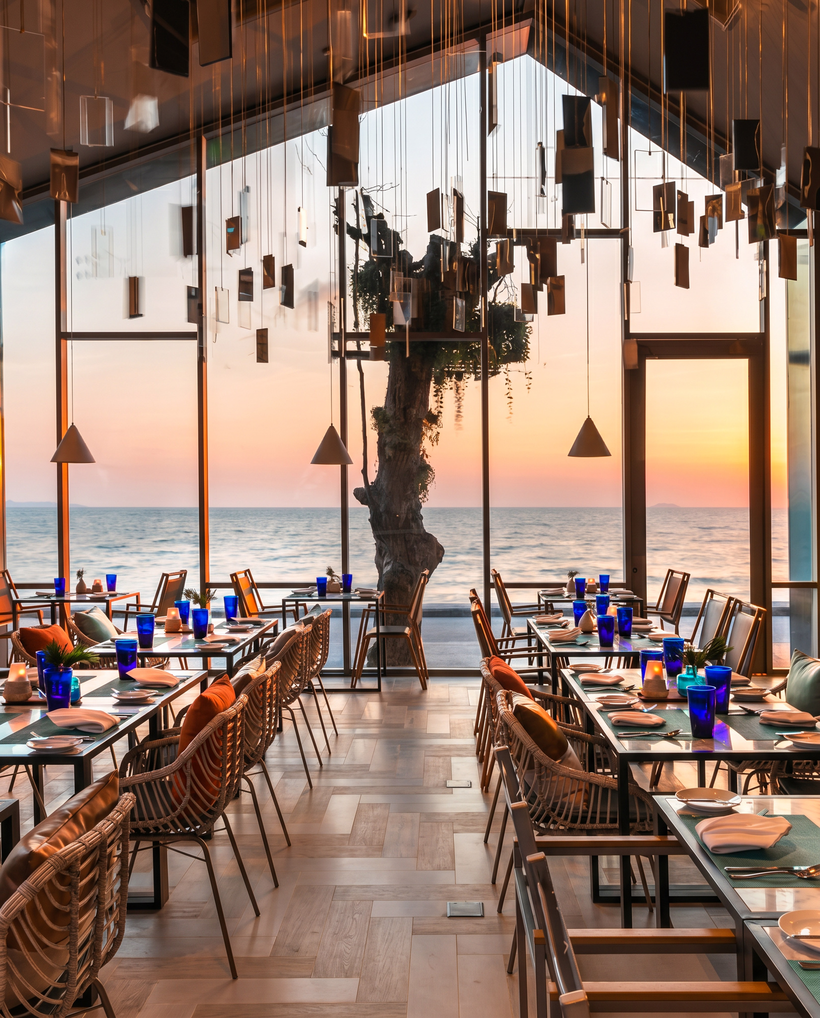 Jomtien beach strip open air dining tables at sunset