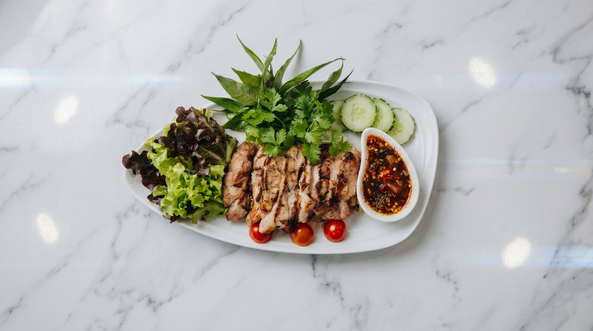 Kor Moo Yang grilled pork neck Isaan style dipping sauce